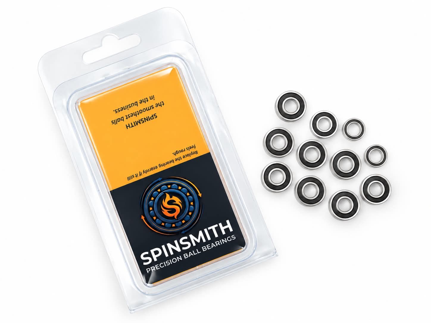A Spinsmith blister pack laid flat surrounded by loose precision ball bearings